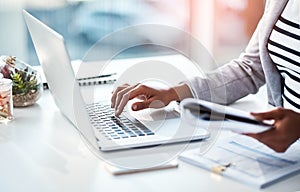 Hands of a female entrepreneur sending emails and doing research on the internet. Businesswoman, secretary and data