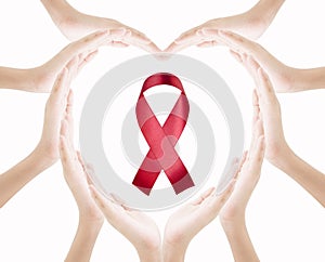 Hands female heart shape with red ribbon isolated on white background , love care world aids day concept