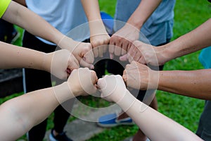 Hands fist join together as commitment of strong team work