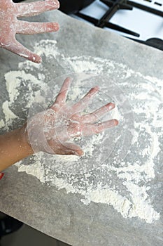 Hands in flour. Homemade cake. Cooking in the kitchen