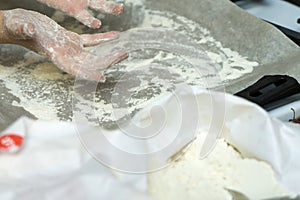 Hands in flour. Homemade cake. Cooking in the kitchen