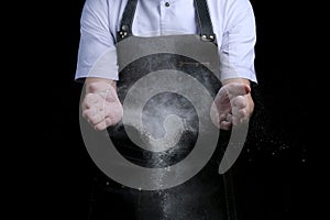 Hands and flour in splash baker clap on black back
