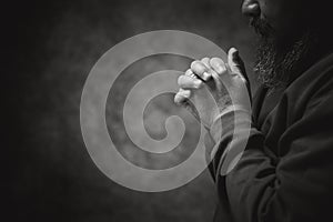 Hands folded in prayer on in church concept for faith, spirituality and religion, man praying in the morning. man hand with