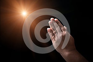 Hands folded in prayer on in church concept for faith, spirituality and religion, man praying in the morning. man hand with