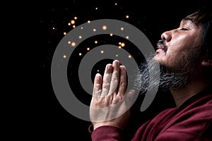 Hands folded in prayer on in church concept for faith, spirituality and religion, man praying in the morning. man hand with