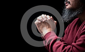 Hands folded in prayer on in church concept for faith, spirituality and religion, man praying in the morning. man hand with