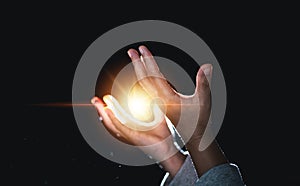 Hands folded in prayer in church. Concept for faith, spirituality and religion. Woman praying in the morning have Yellow lights