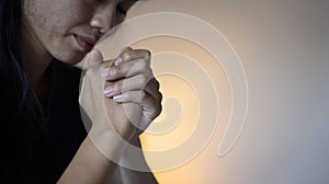 Hands folded in prayer concept for faith, Religious young woman praying to God in the morning, spirtuality and religion, Religious