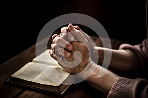 Hands folded in prayer on a Holy Bible in church concept for faith AI generated