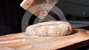 Hands folding and kneading dough