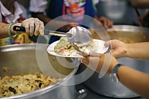 Hands-on food of the hungry is the hope of poverty : concept of homelessness photo
