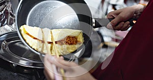 Hands, food or omurice in kitchen with chef for Japanese lunch, dinner or healthy meal for nutrition. Person, omelette