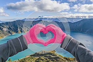 Hands Forming Heart Shape at Quilotoa Lake, Latacunga, Ecuador photo
