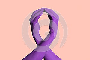 hands forming a violet awareness ribbon