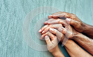 Hands of four generations close-up .