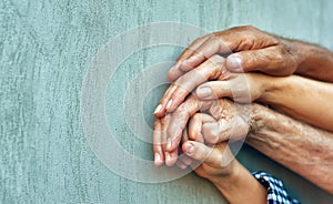 Hands of four generations close-up .