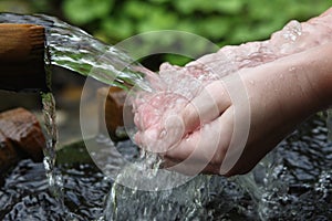 Hands and fresh water photo