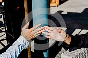 Hands of friendly men greeting each other by touching their fingers