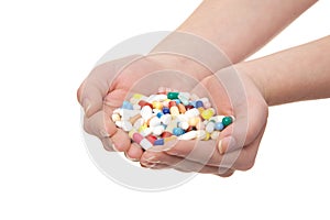 Hands full of pharmaceuticals