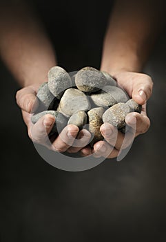 Hands full of rocks