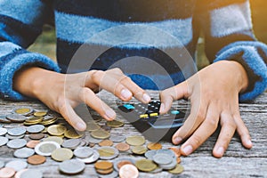 Hands girl holding calculator and coin