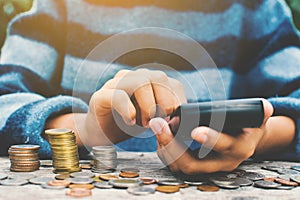 Hands girl holding calculator and coin