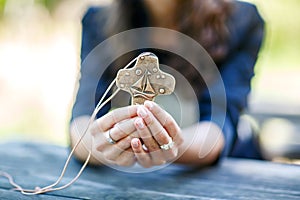 Hands of girl holding crucifix for holy confirmation or communion.