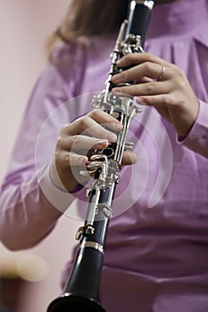 Hands girl playing the clarinet