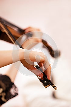 Hands of the girl playing the violin