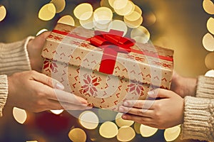 Hands giving x-mas gift