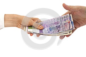 Hands giving money International currencies away
