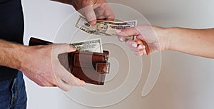 Hands giving money on white background