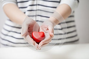 Hands giving red heart, valentine festival and safety concept