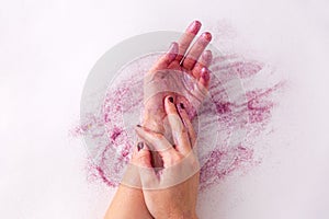 Hands with glitters on white background