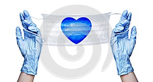 Hands in gloves, medical face mask, blue heart pattern, coronavirus protection on Valentines Day concept, love and safety symbol