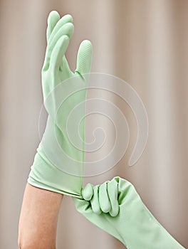 Hands, gloves and person with cleaning for hygiene at home for bacteria, germs and health hazards. Safety, protection