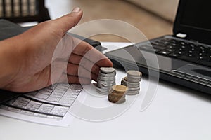 Hands grabbed coins on the table, version 1