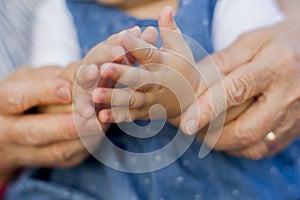 Hands of granddaughter with grandmother