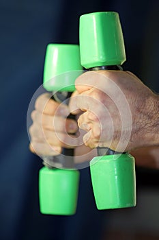 Hands on Green Dumbbells