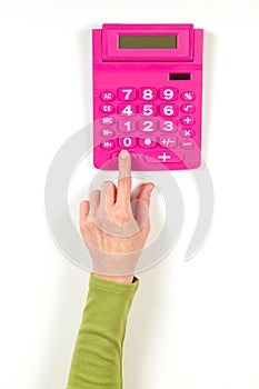 Hands in green jacket and red calculator