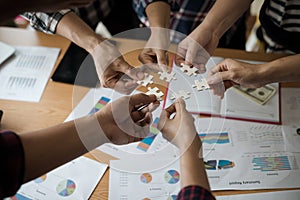 Hands group of business people assembling jigsaw puzzle white. B