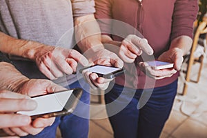 Hands of group of people using smartphones, mobile online communication or social network