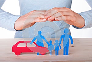 Hands Guarding Family and Car