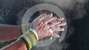 Hands of Gymnast Clapping Chalk Slow Motion