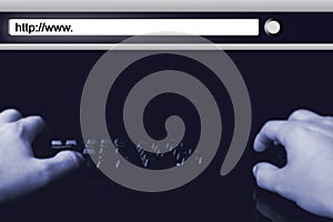 Hands of hacker on keyboard