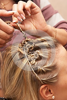 Hands of hairdresser celebratory stacking hair