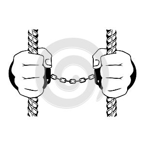 Hands in handcuffs behind bars