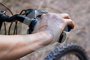 Hands on handlebar bicycle on nature background