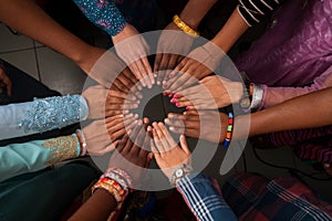 Hands of happy group of African people which stay together in circle