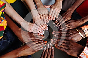 Hands of happy group of African people which stay together in circle